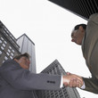 Low angle view of businessmen shaking hands