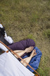 Legs and feet of couple sticking out of tent