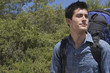 Man with backpack looking