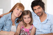happy parents with daughter