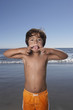 Portrait of boy making face at beach