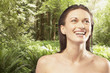 Portrait of woman smiling in forest