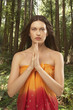 Woman in forest praying