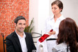 Sommelier presenting a wine to a restaurant patron