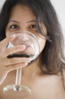 Photo: Young woman drinking a glass of wine Young woman drinking a glass of wine