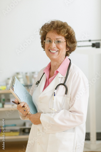 Photo: Female doctor smiling for the camera Female doctor smiling for the camera