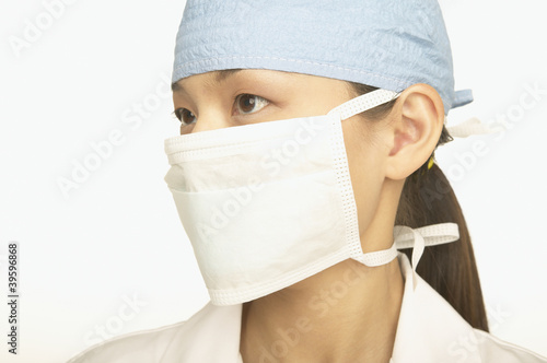 Photo: Female doctor wearing a face mask Female doctor wearing a face mask