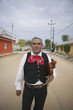 Senior Mariachi violinist holding violin