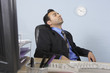 Businessman asleep at his desk
