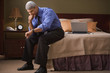 Businessman checking the time in his hotel room