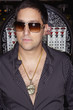 Young man wearing a pendant and sunglasses