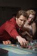 Couple gambling in a casino