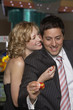 Woman hugging her boyfriend at a casino