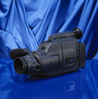 Old video camera on blue background
