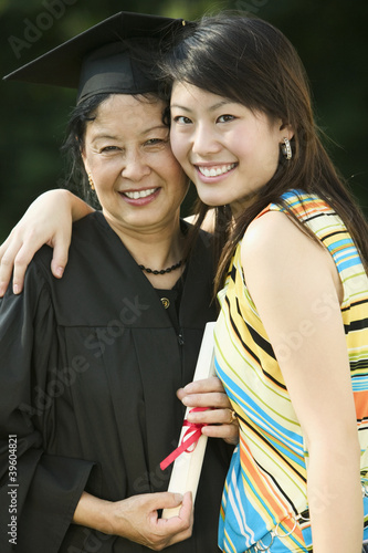 Photo: Mother and daughter posing at graduation Mother and daughter posing at graduation