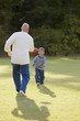 Father and son playing football