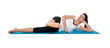 Beautiful young female exercising on a blue matt