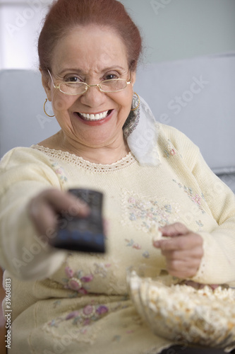 Photo: Elderly woman watching television Elderly woman watching television