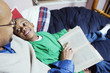 Father reading book to son