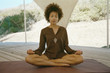 African American woman meditating in screened area