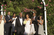 Wedding guests applauding newlyweds
