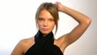 Sexy blond woman in dress looking, posing and smiling