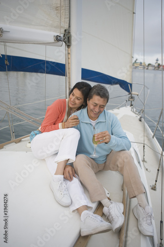 Photo: Couple enjoying their sailboat Couple enjoying their sailboat