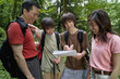 Family checking map while hiking