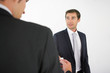 Two men exchanging business cards