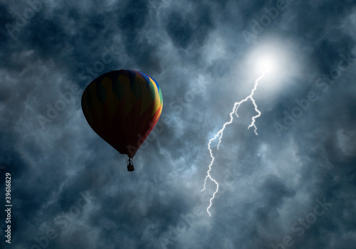 Photo: Hot-Air Balloon Among Dark Storm Clouds with Lightning Hot-Air Balloon Among Dark Storm Clouds with Lightning