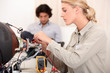 Woman fixing a television