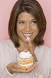 Photo: Portrait of woman tasting pastry Portrait of woman tasting pastry