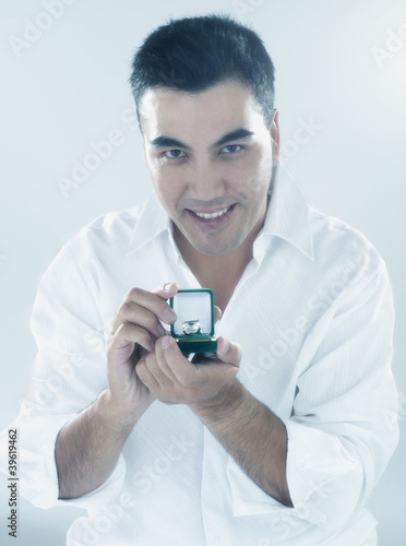 Photo: Young man proposes to camera Young man proposes to camera