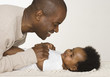 Father changing his baby daughter's diaper