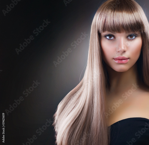 Photo: Beautiful Girl with Blond Hair. Healthy Long Hair Beautiful Girl with Blond Hair. Healthy Long Hair