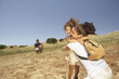 Mother and daughter hugging outdoors