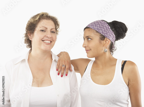 Photo: Young woman and her mother posing for the camera Young woman and her mother posing for the camera
