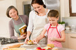 Mother and daughter prepare dough home cake