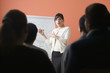 Woman giving presentation in meeting