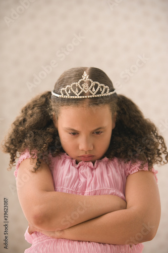 Photo: Young girl pouting with princess crown Young girl pouting with princess crown