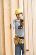 Construction worker drilling wood