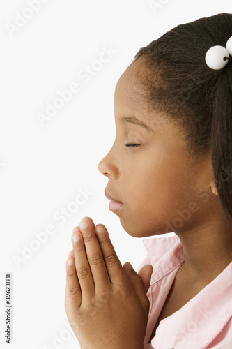 Photo: Young girl praying Young girl praying