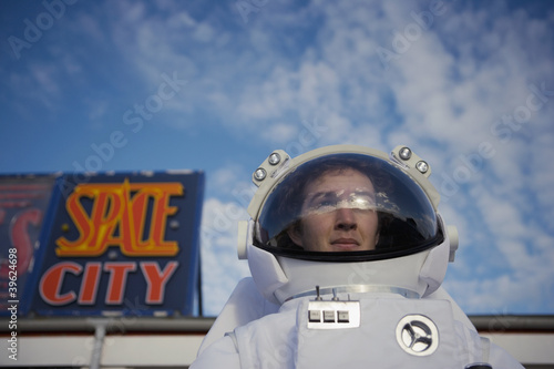 Photo: "Man in spacesuit leaving ""Space City""" "Man in spacesuit leaving ""Space City"""