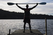 Young man holding canoe oar