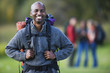Young backpacker smiling for the camera outdoors