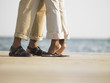 Couple's feet on a wooden deck