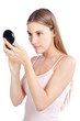 Photo: Woman Looking at Compact Mirror Woman Looking at Compact Mirror