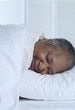 Senior woman asleep in bed