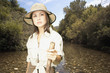 Explorer standing in riverbed