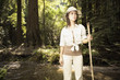 Explorer standing in forested area